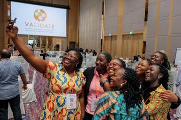 Lydia (left) with colleagues at the VALIDATE Annual Meeting 2024