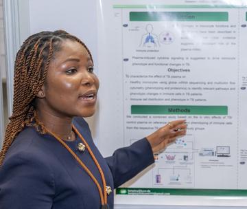 Millicent presenting her poster at the at the VALIDATE Annual Meeting 2025