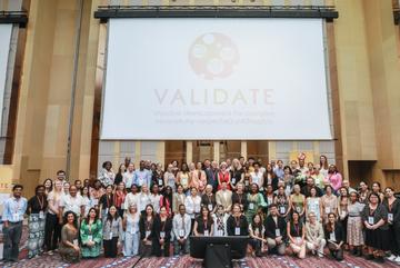 The VALIDATE Annual Meeting 2024 - A group photo of all delegates below the VALIDATE Logo The VALIDATE Annual Meeting 2024 - A group photo of all delegates below the VALIDATE Logo