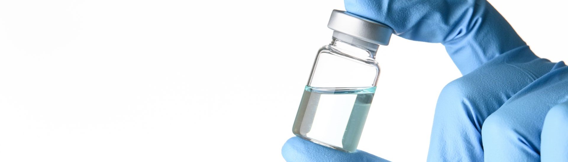 Scientist holding vaccine vial