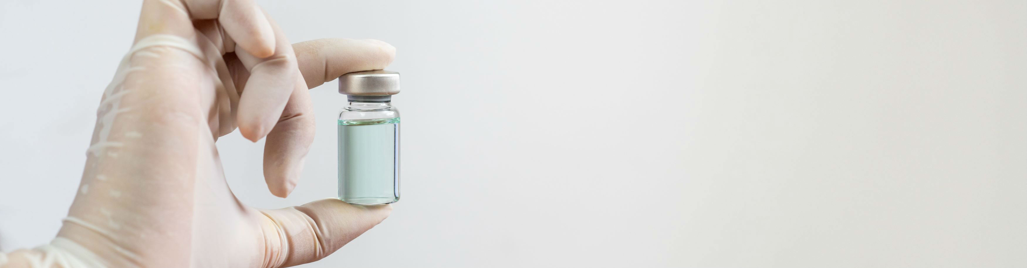 Vaccine Vial being held