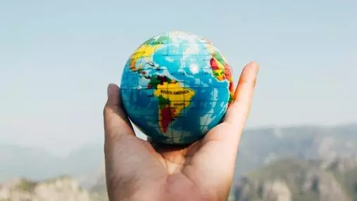 Globe being held