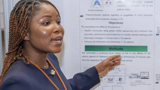 Millicent presenting her poster at the at the VALIDATE Annual Meeting 2025