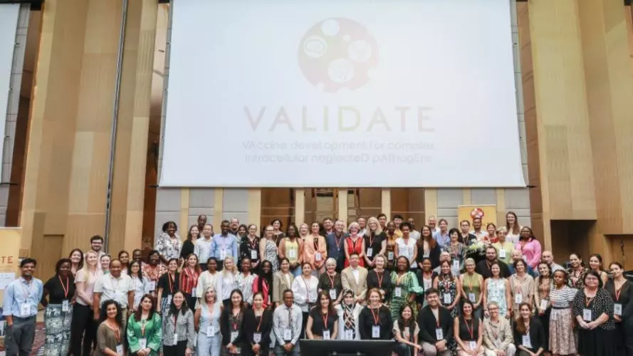 The VALIDATE Annual Meeting 2024 - A group photo of all delegates below the VALIDATE Logo