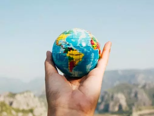 Globe being held