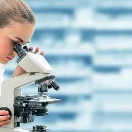 Scientist with a microscope