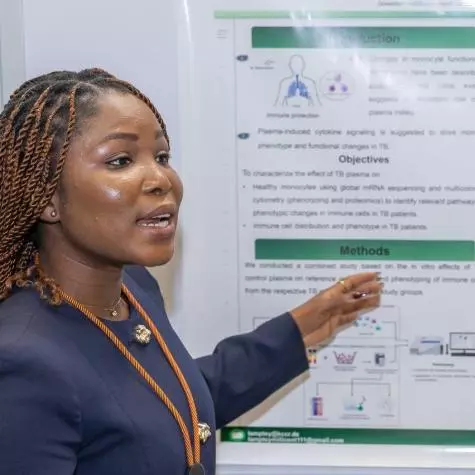 Millicent presenting her poster at the at the VALIDATE Annual Meeting 2025