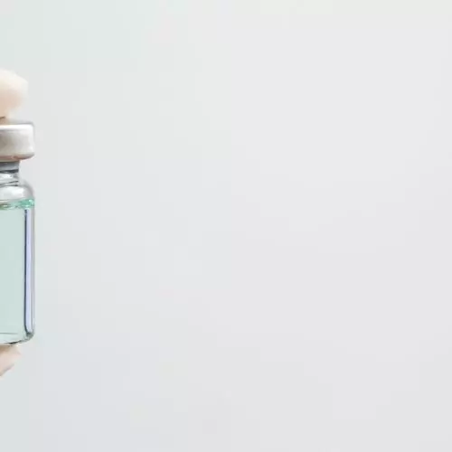 Vaccine Vial being held