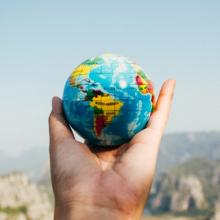 Globe being held